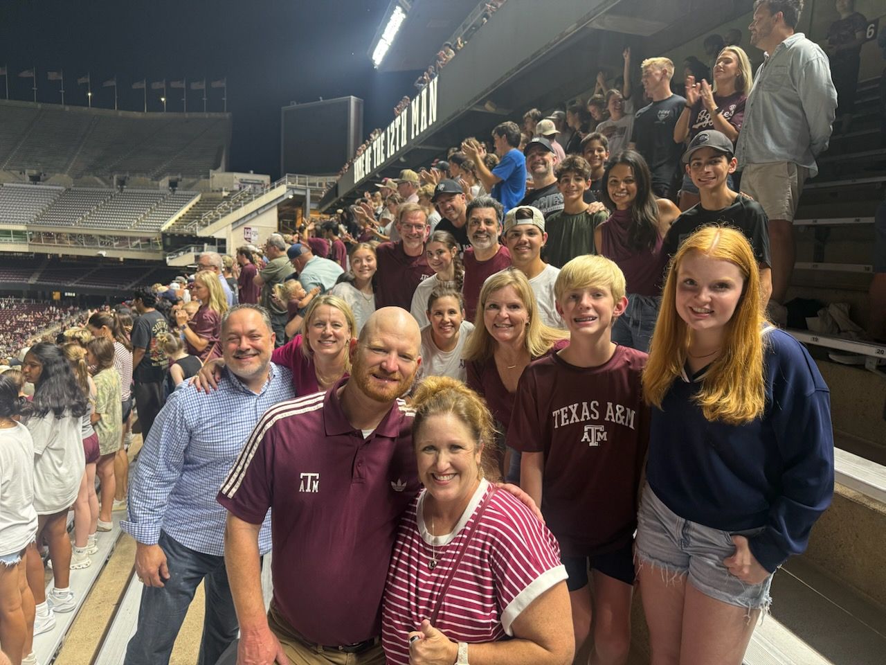 BYX families together in the stands at Friday night yell practice
